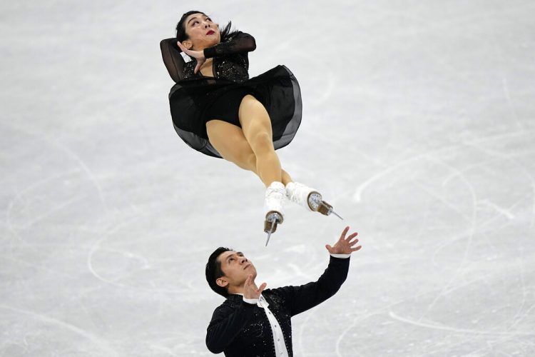 Fri. 907 a.m. Olympics Update China pair breaks figure skating world